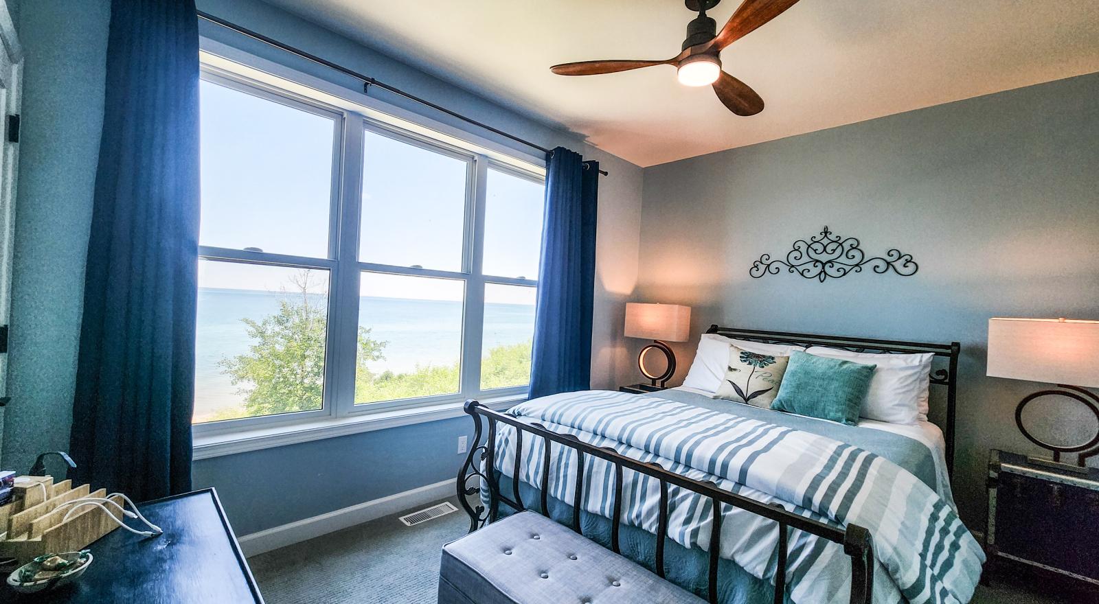 Superior room has queen bed and panoramic lake view