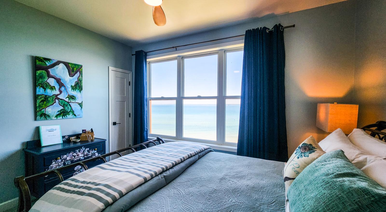 Superior room luxury bed with panoramic lake view